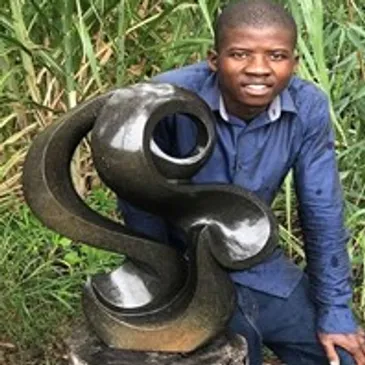Portrait of Zimbabwean sculptor Brian Chapenga