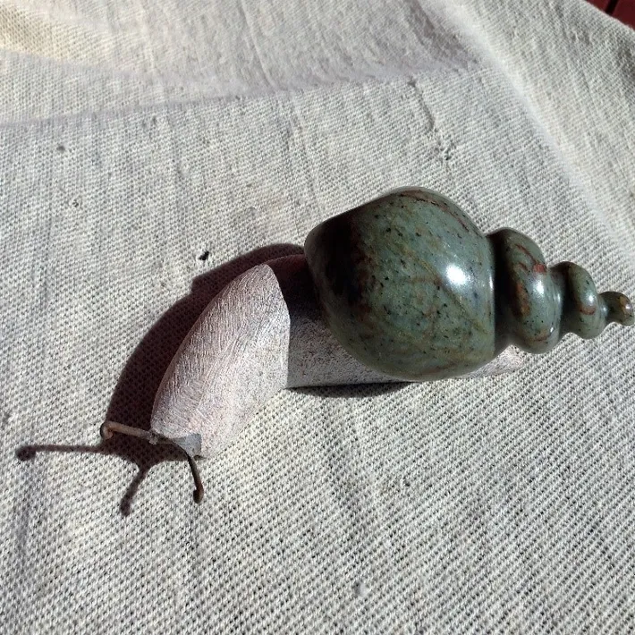 Stone snail sculpture by Zimbabwean sculptor Brighton Layson